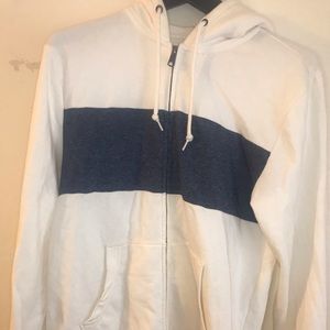 White hoodie with a blue stripe in the chest